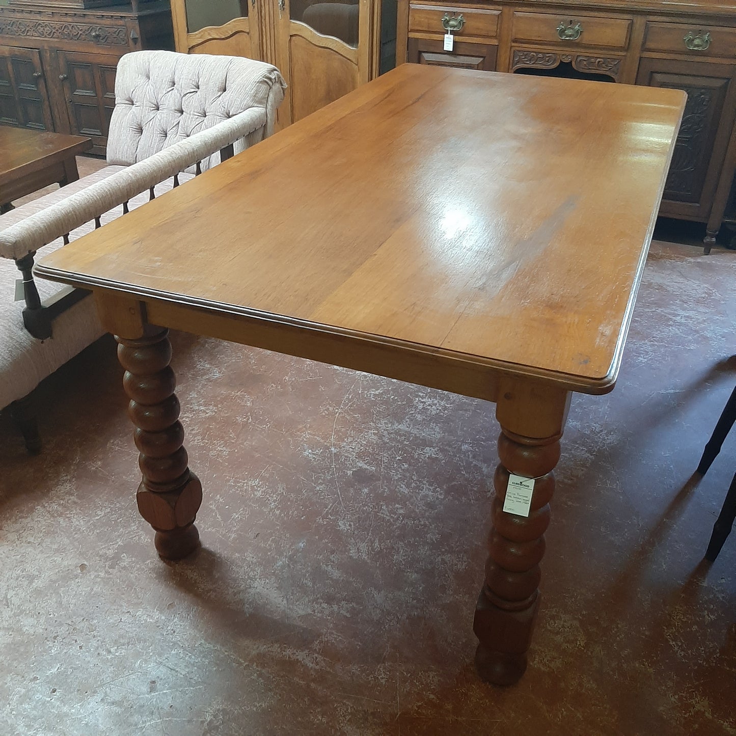 Antique table with bobbin legs