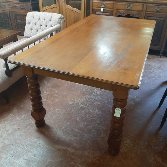 Antique table with bobbin legs