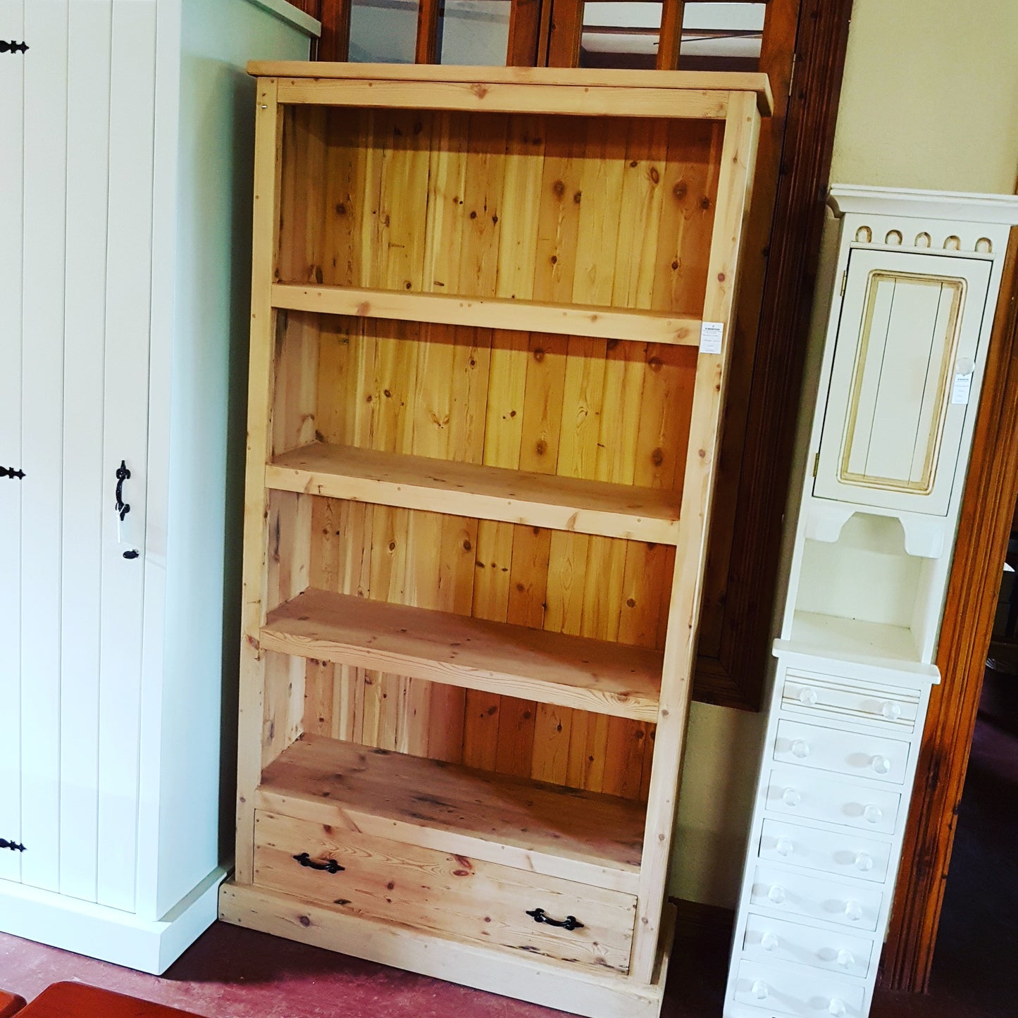 Bookcase with 4 shelves and a drawer