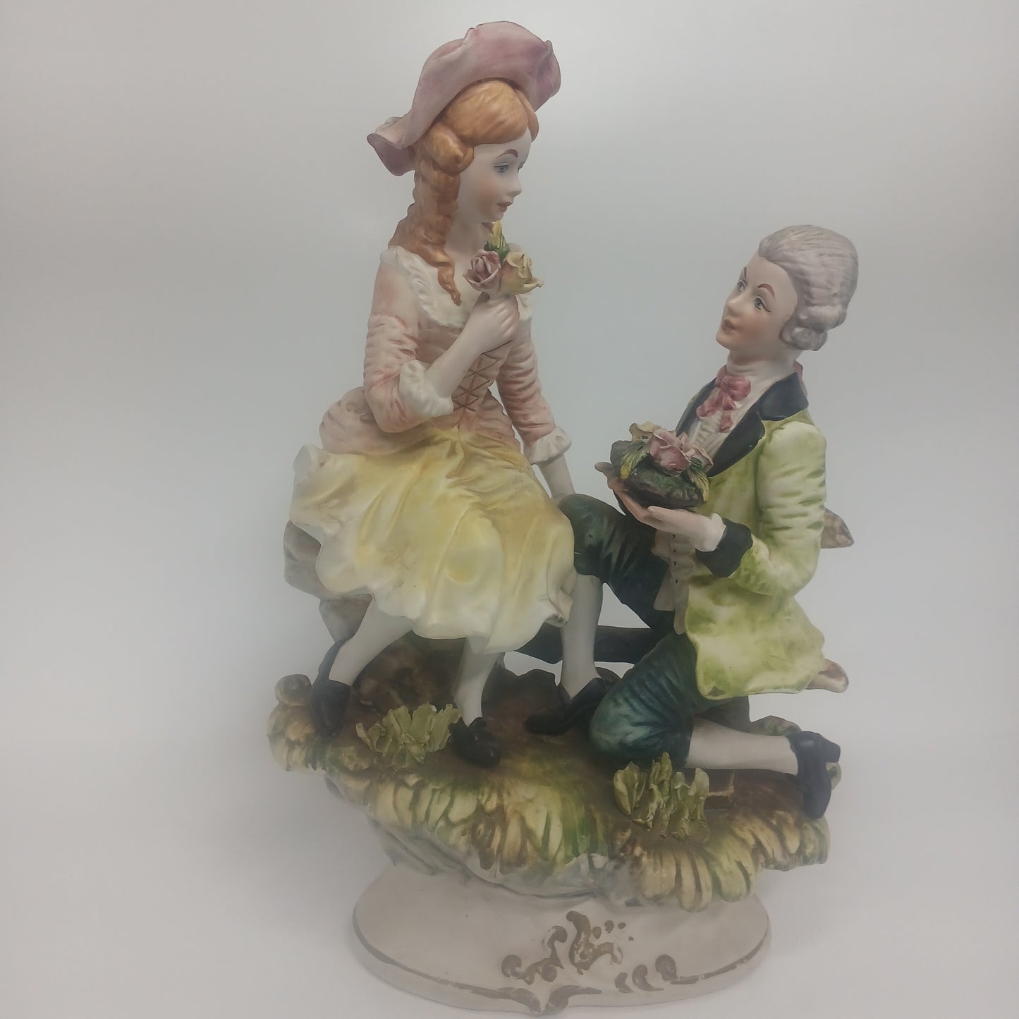 Capodimonte figurine man asking for marriage