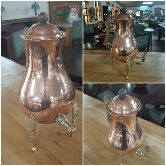 Copper pot on brass legs