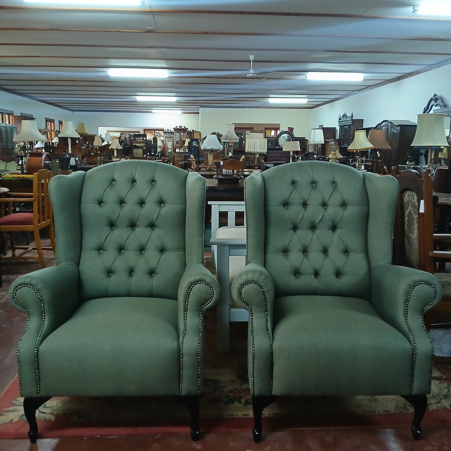 Deep buttoned new wingback chairs