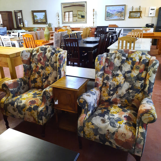 Deep buttoned wing back chairs