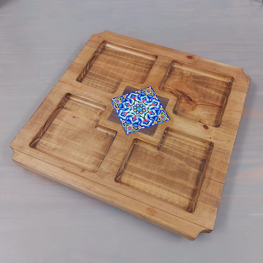 4 division snack board with a tile in the middle