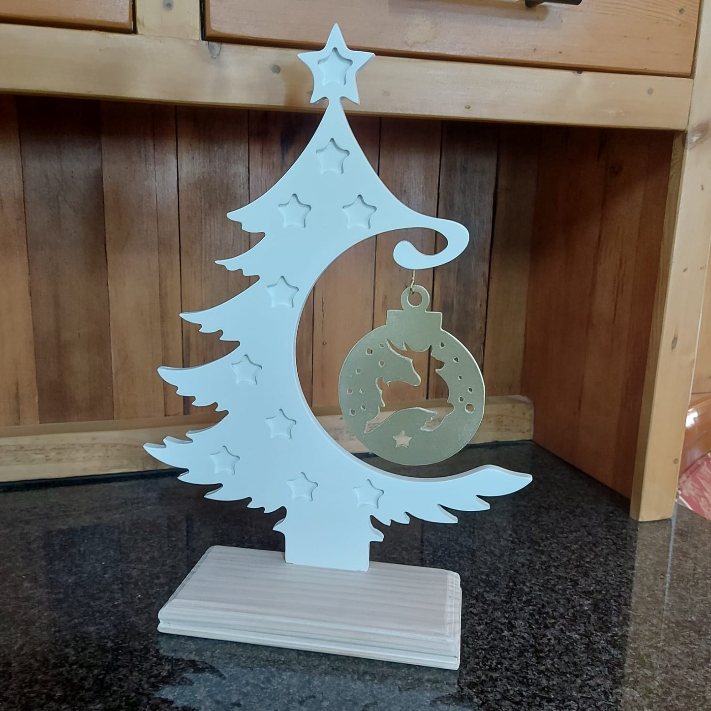 White painted Christmas tree with a reindeer deco