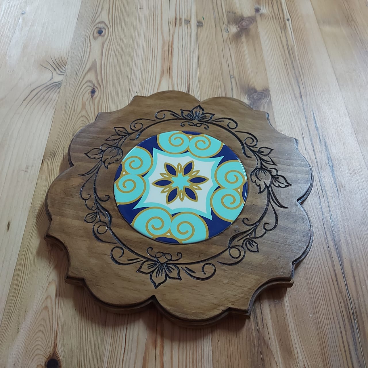 Engraved ornate board with tile