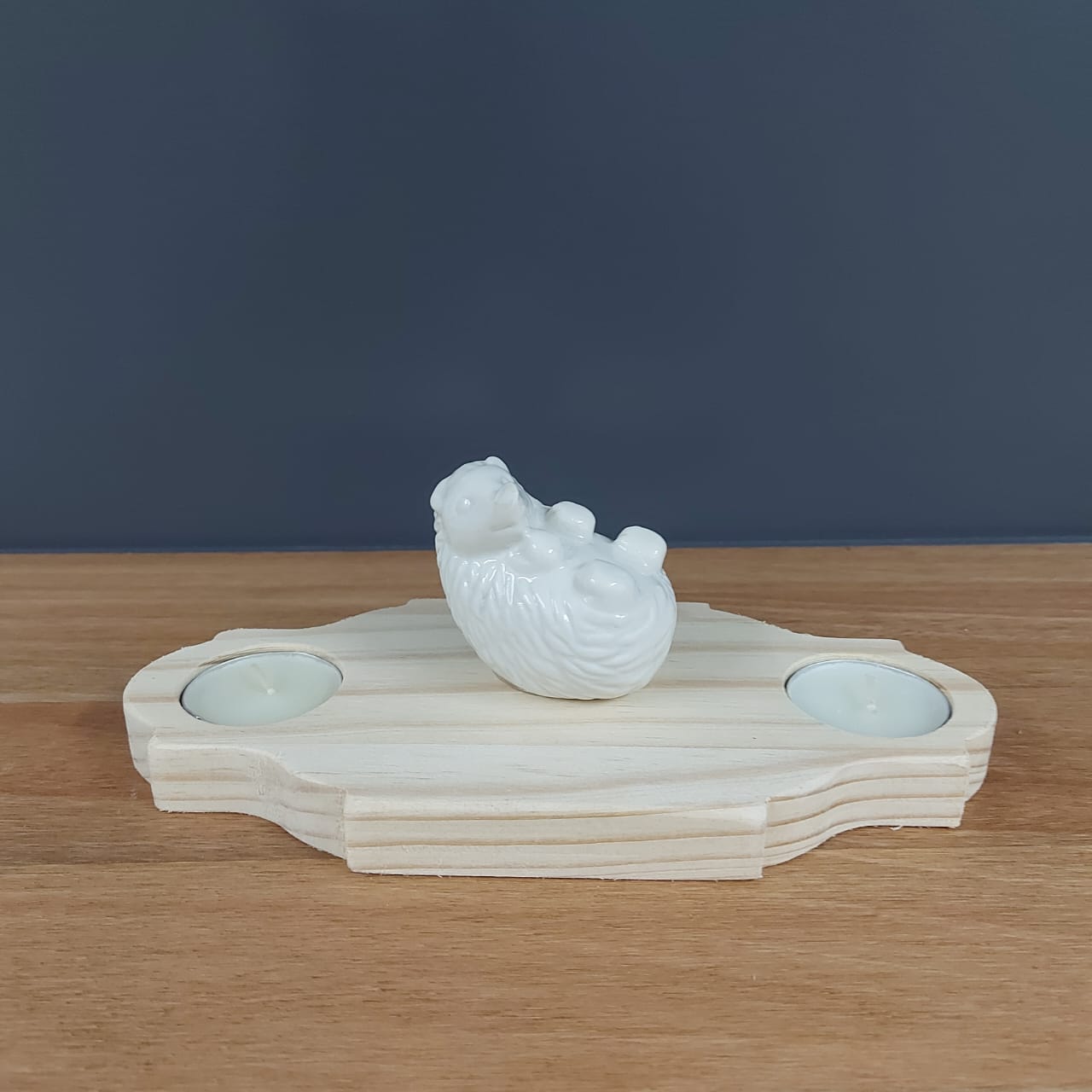 2 candles and a hedgehog deco