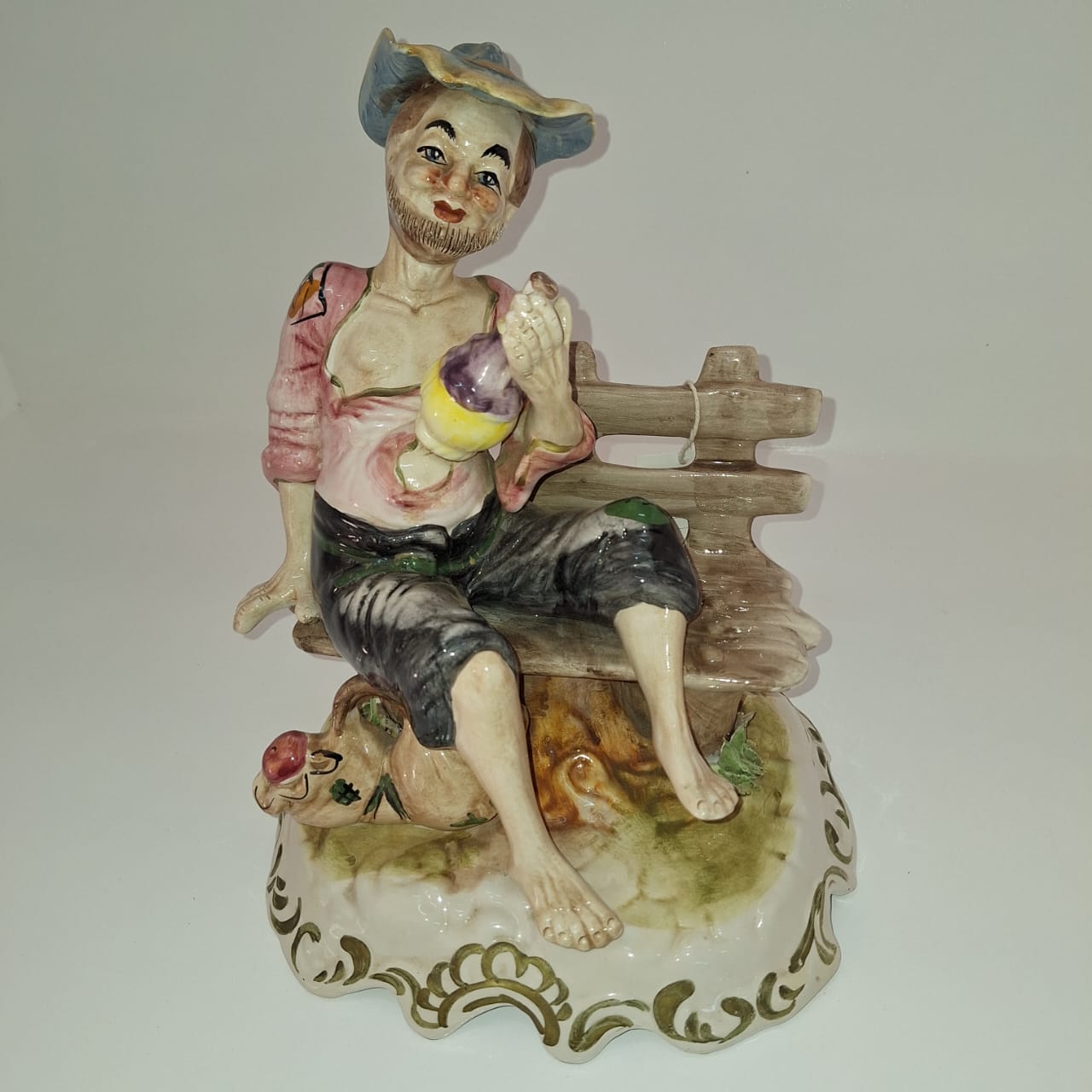Man on Bench Figurine