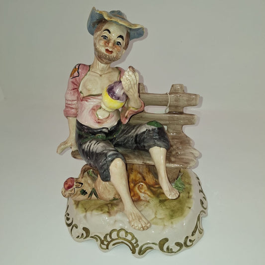 Man on Bench Figurine
