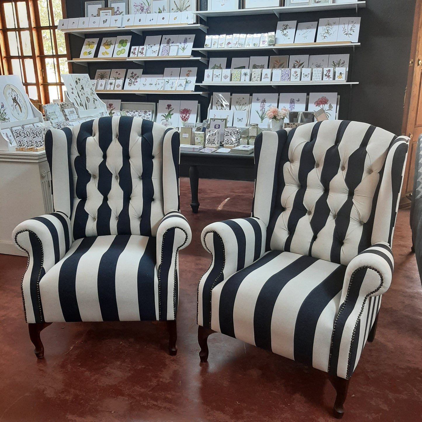 Large stripped wingback chairs