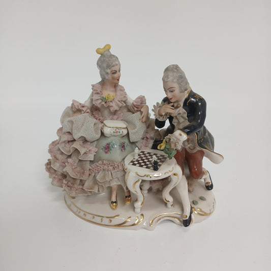 A couple playing chess Capodimonte figurine