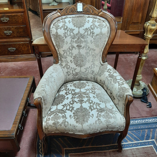 Walnut upholstered armchair